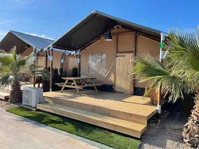 a house with a picnic table in front of it at Devesa Gardens in El Saler