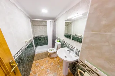 a bathroom with a sink and a toilet at Casa Pescadores de Vallterra in El Palmar
