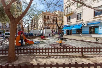 a city street with a park with people and a tree at Apartment City of Arts and Sciences 2 in Valencia