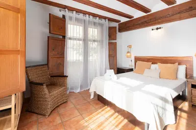 a bedroom with a white bed and a window at Travel Habitat Plaza del Pilar. in Valencia