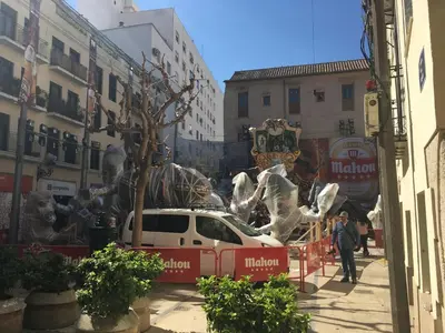a car parked in a street with a tree on its roof at Travel Habitat Plaza del Pilar. in Valencia
