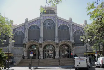 a large building with stairs in front of it at Travel Habitat Plaza del Pilar. in Valencia
