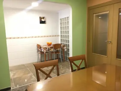 a dining room with a table and chairs at Apartament Magnífico in Paiporta