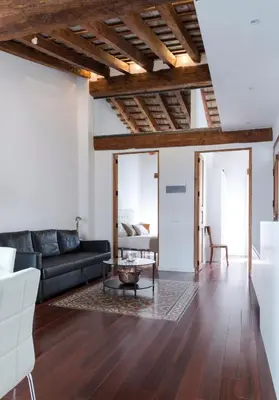 a living room with a couch and a table at Apartments Downtown Valencia in Valencia