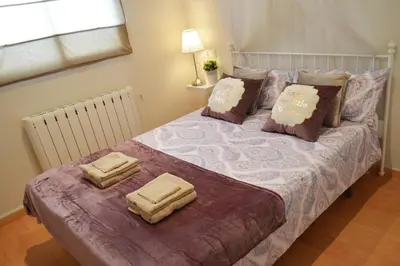 a bedroom with a bed with two pillows on it at Casa Rural La Tramontana in Estivella