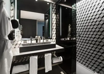 a bathroom with a sink and a large mirror at One Shot Mercat in Valencia