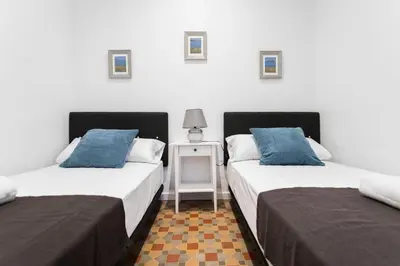 two beds sitting next to each other in a room at Total Valencia Vintage in Valencia
