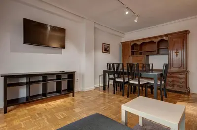 a kitchen with white appliances and wooden cabinets at Beds & Breaks Ferrero in Valencia