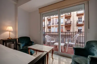 a living room with a couch and a flat screen tv at Beds & Breaks Ferrero in Valencia