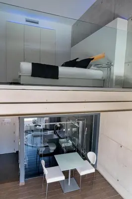 a room with a bed and a table and chairs at Shhh in Onda