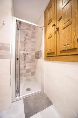 a bathroom with a shower with a glass door at Casa Rural Francisca in Requena