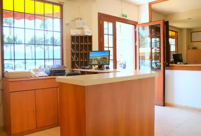 a room with a counter with a computer on it at Hotel Carabela 2 in Cullera