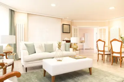 a living room with a white couch and a table at MD Villa Cullera Cap Blanc in Faro de Cullera