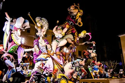 a group of cartoon characters on a float in a parade at Casa Cabanyal in Valencia