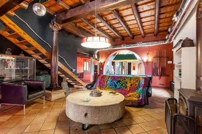 a living room with a couch and a table at Ca Carmela casa con Encanto con Piscina 