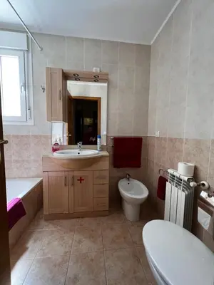 a bathroom with a sink and a tub and a toilet at La perla de oasis in Lliria