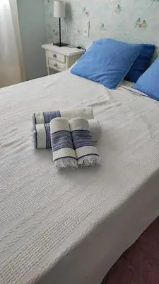 a white bed with two pillows on it at Apartamento in Valencia