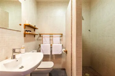 a bathroom with a sink and a toilet and a shower at Casa Sibarita in Rafelguaraf