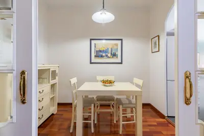 a kitchen with a table and chairs in a room at Ruzafa Luis Santangel in Valencia
