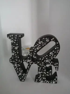 a black metal letter k with beads on it at Valencia what else... in Valencia