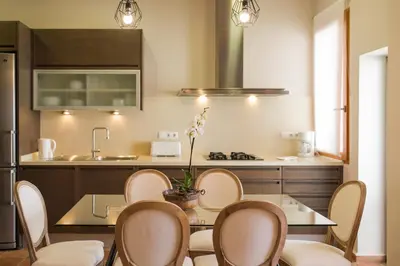 a kitchen with a table and chairs in a kitchen at MD Sueca in Valencia