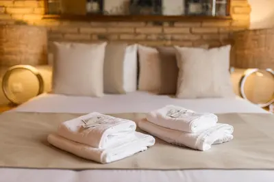two towels sitting on top of a bed at MD Sueca in Valencia