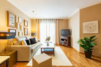 a living room with a couch and a tv at MD Abastos in Valencia
