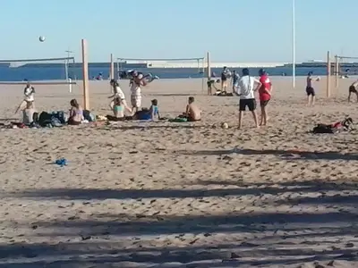 a group of people playing soccer on the beach at Apartamento Sofia in Valencia