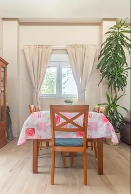 a dining room with a table and a chair at Ca Emma in Mahuella