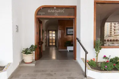 an entrance to a building with plants in the doorway at Arensol Esc-A, 13º-51 in Cullera