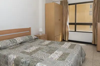a bedroom with a bed and a window at Estirpe, 2º-3 in Cullera