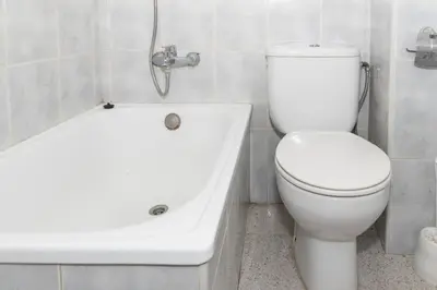 a bathroom with a white toilet and a bath tub at Estirpe, 2º-3 in Cullera