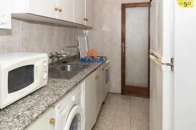 a kitchen with a sink and a microwave at Estirpe, 3º-5 in Cullera