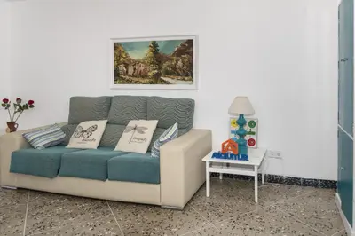 a living room with a couch and a table at Europa B 6º-23 in Cullera