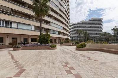 a courtyard in front of a building with two tall buildings at Florazar 2, Ix-9-C in Cullera