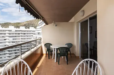a balcony with a table and chairs on it at Florazar 2, Vi-11-C in Faro de Cullera