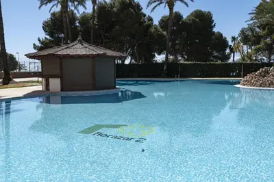 a swimming pool with a gazebo on top of it at Florazar 2, Vi-13-C in Faro de Cullera