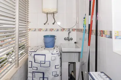 a small bathroom with a sink and a mirror at Florazar 2, Vi-15-A in Cullera