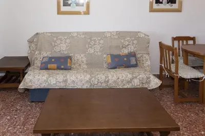 a living room with a couch and a table at Florazar 2, Vi-7-C in Cullera