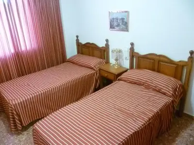 two beds in a room with red and white stripes at Florazar 2, Viii-8-B in Cullera