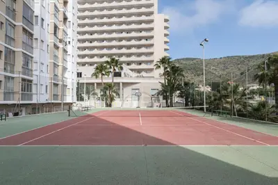 a tennis court in front of a building at Florazar 3, 3-C in Cullera