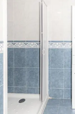 a shower with a glass door in a bathroom at Lider, 4-D in Cullera