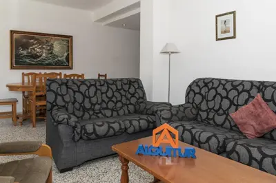 a living room with a couch and a table at Miralmar, 10º-69 in Cullera