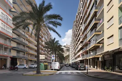 a city street with palm trees and buildings at Miralmar, 10º-69 in Cullera
