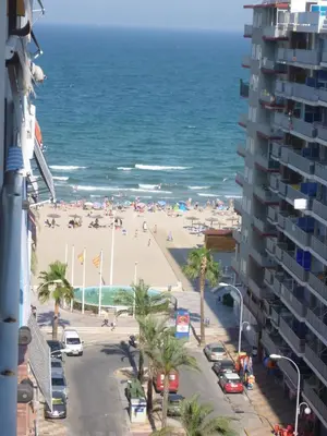 a view of a beach and the ocean from a building at Miralmar, 10º-69 in Cullera
