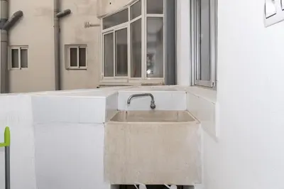 a concrete sink in a room with a window at Miralmar, 10º-69 in Cullera