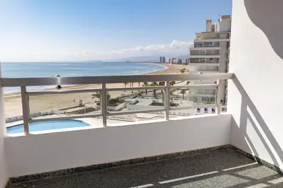 a balcony with a view of the beach at Prado, B-6º-64 in Cullera