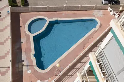 an overhead view of a swimming pool on a building at Santa Marta, Iii-A 7º-16 in Cullera