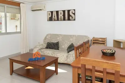 a living room with a couch and a table at Seniades, 6º-16 in Cullera