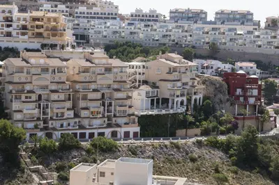 a group of houses on a hill with buildings at Villas Cap Blanc Ii, Pta 11 in Cullera
